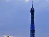 Eiffel Tower at sunset with statue